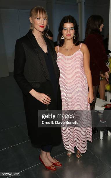 Jade Parfitt and Pixie Geldof attend the House of Holland show during London Fashion Week February 2018 at TopShop Show Space on February 17, 2018 in...
