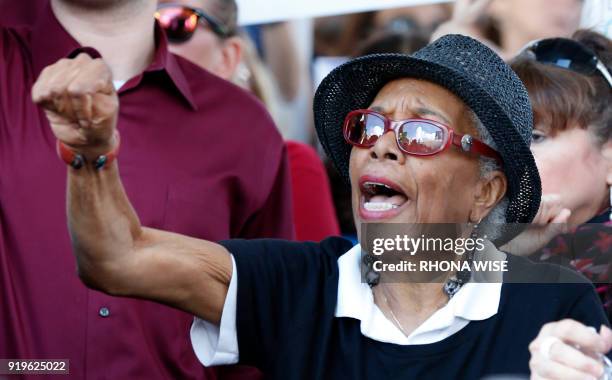 Protesters cheer at a rally for gun control at the Broward County Federal Courthouse in Fort Lauderdale, Florida on February 17, 2018. Seventeen...
