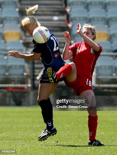Rochelle Kuhar from Adelaide competes with Kara Mowbray from Melbourne during the round three W-League match between Adelaide United and the...