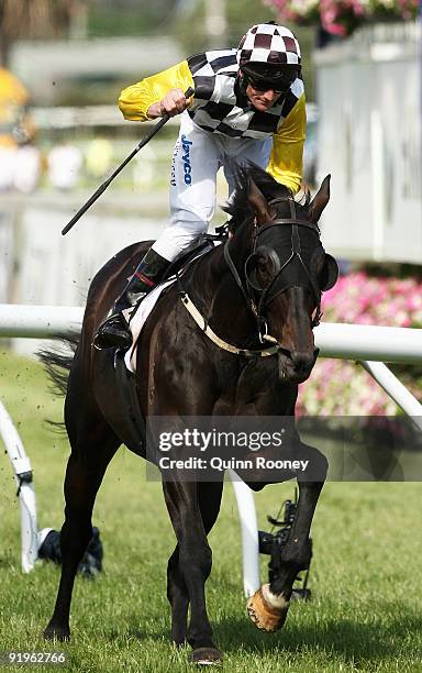 Brad Rawiller riding Viewed celebrates as he crosses the line to win the Caulfield Cup during the Caulfield Cup Day meeting at Caulfield Racecourse...