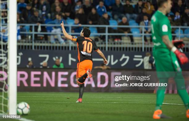 Valencia's Spanish midfielder Dani Parejo celebrates scoring a goal during the Spanish league football match between Malaga CF and Valencia CF at La...