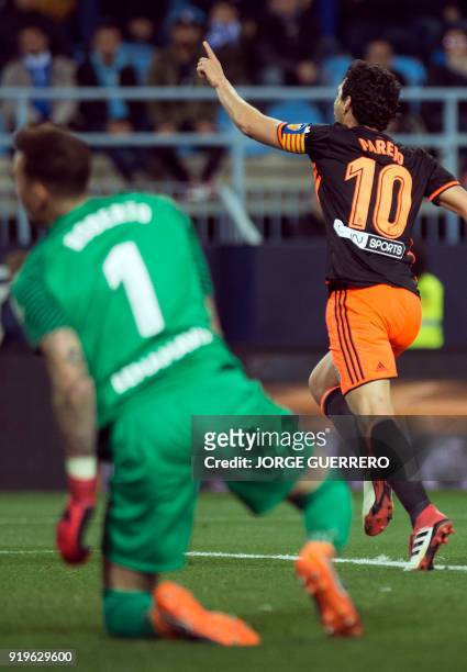 Valencia's Spanish midfielder Dani Parejo celebrates scoring a goal during the Spanish league football match between Malaga CF and Valencia CF at La...