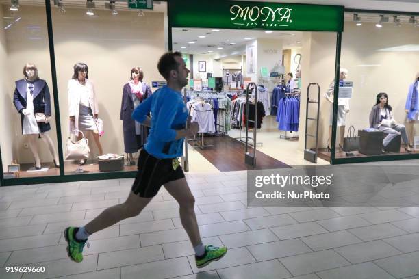 Runner running in front of Mona Pro Moda shop is seen in Gdansk, Poland on 17 February 2018 Runners take part in the Manhattan Run - run competition...