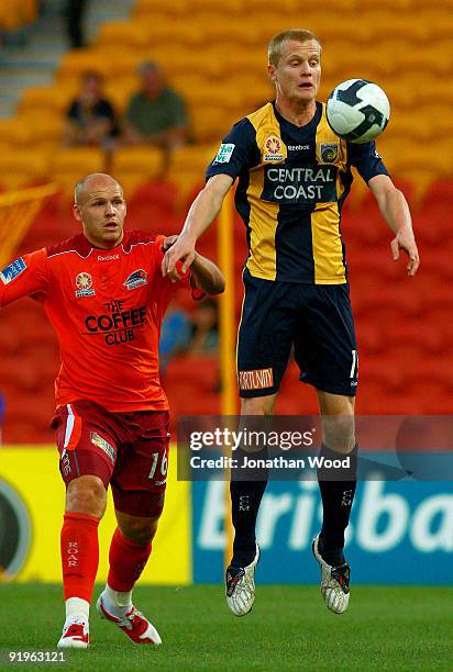 Matthew Simon of the Mariners controls the ball while under pressure during the round 11 A-League match between the Brisbane Roar and the Central...