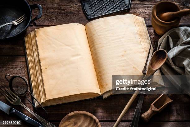 vintage cookbook with kitchen utensils - cookbook stock pictures, royalty-free photos & images