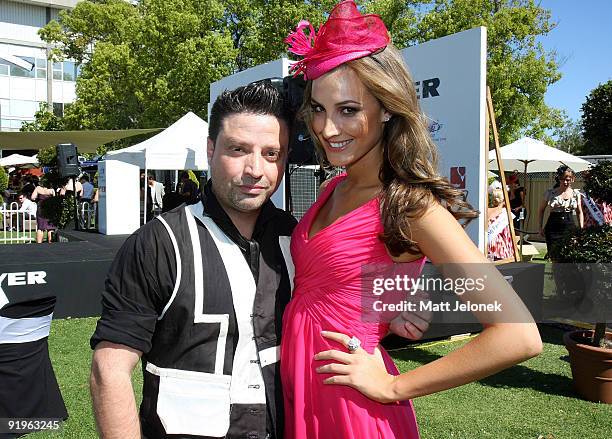 Designer Ray Costarella of Aurelio Costarella with Laura Dundovic pose during the Myer Fashions on the Field at Ascot Racecourse on October 17, 2009...