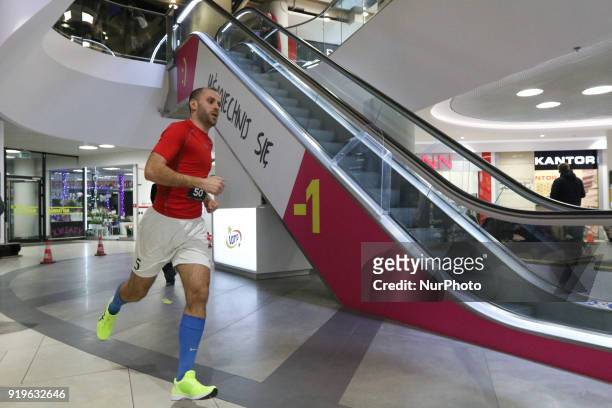 Runner running in front of escalator is seen in Gdansk, Poland on 17 February 2018 Runners take part in the Manhattan Run - run competition inside...