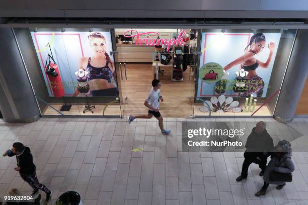 Runner running in front of Triumph shop is seen in Gdansk, Poland on 17 February 2018 Runners take part in the Manhattan Run - run competition inside...