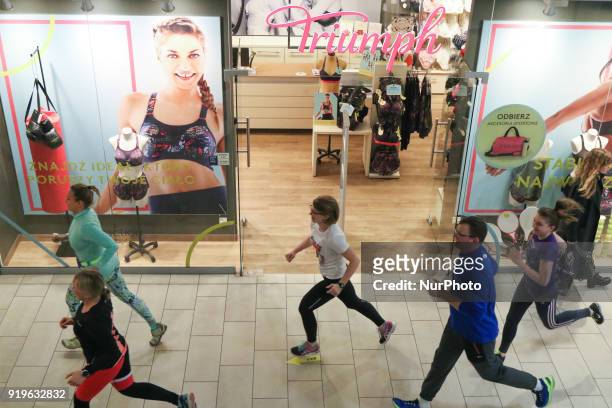 Runners running in front of Triumph shop are seen in Gdansk, Poland on 17 February 2018 Runners take part in the Manhattan Run - run competition...