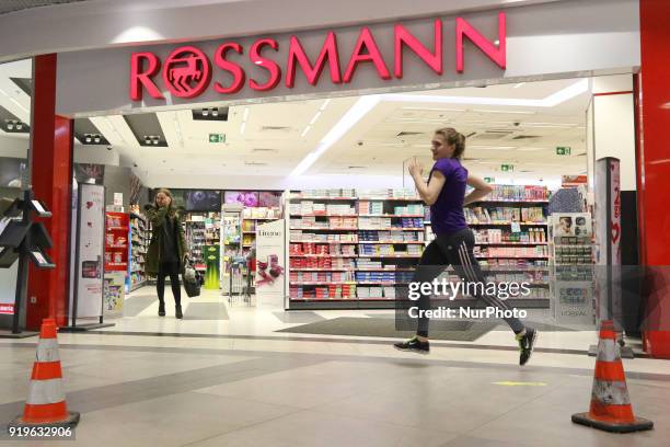 Runner running in front of Rossmann shop is seen in Gdansk, Poland on 17 February 2018 Runners take part in the Manhattan Run - run competition...