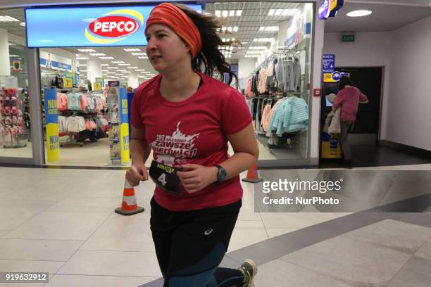 Runner running in front of Pepco shop is seen in Gdansk, Poland on 17 February 2018 Runners take part in the Manhattan Run - run competition inside...