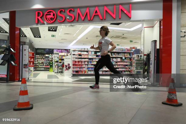 Runner running in front of Rossmann shop is seen in Gdansk, Poland on 17 February 2018 Runners take part in the Manhattan Run - run competition...