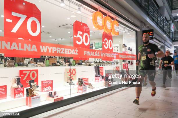 Runners running in front of CCC shop are seen in Gdansk, Poland on 17 February 2018 Runners take part in the Manhattan Run - run competition inside...