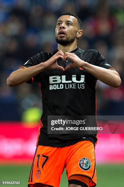 Valencia's French midfielder Francis Coquelin celebrates scoring a goal during the Spanish league football match between Malaga CF and Valencia CF at...