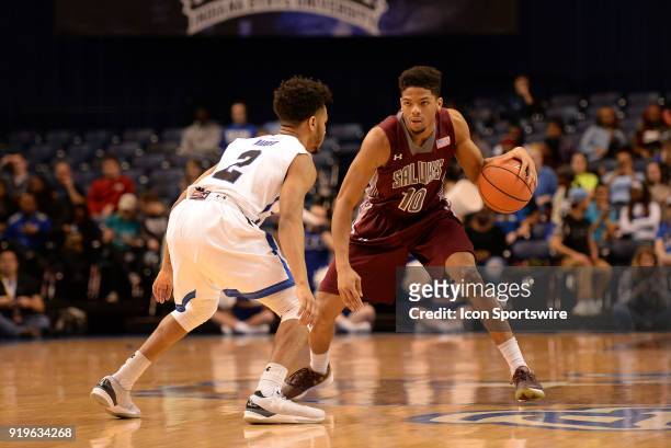 Indiana State Sycamores guard Jordan Barnes guards Southern Illinois Salukis guard Aaron Cook during the Missouri Valley Conference college...