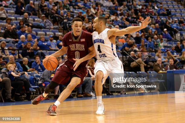 Southern Illinois Salukis forward Jonathan Wiley dribbles into Indiana State Sycamores guard Brenton Scott during the Missouri Valley Conference...