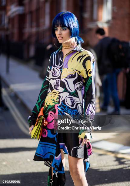 Sita Abellan wearing dress with floral print, JW Anderson bag, white boots seen outside J.W. Anderson during London Fashion Week February 2018 on...