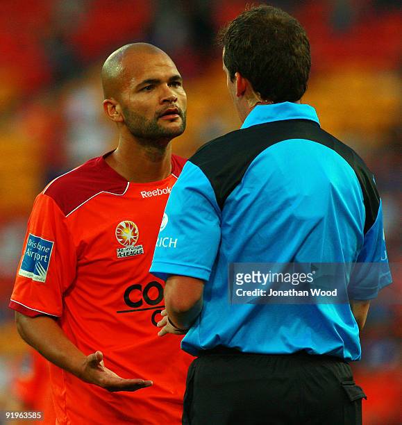 Sergio Van Dijk of the Roar speaks with the referee during the round 11 A-League match between the Brisbane Roar and the Central Coast Mariners at...