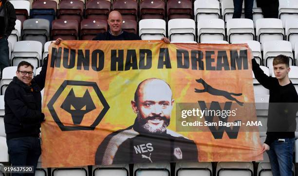 Fans of Wolverhampton Wanderers celebrate with a flag of Nuno Espirito Santo manager / head coach of Wolverhampton Wanderers during the Sky Bet...