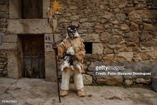 Reveller dressed as 'Harramacho' poses for a portrait during the traditional Navalacruz Carnival on February 17, 2018 in Navalacruz, Spain. The rural...
