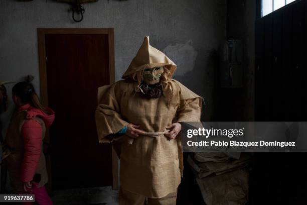 Reveller dressed as 'Harramacho' prepares to take part in the traditional Navalacruz Carnival on February 17, 2018 in Navalacruz, Spain. The rural...