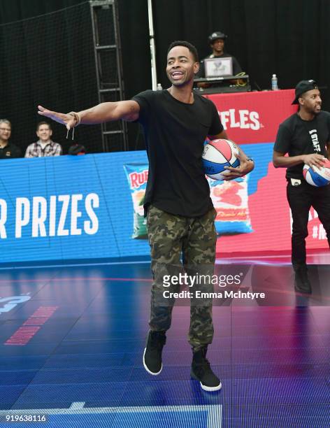 Actor Jay Ellis challenges fans to the 'Around The Ridge' competition at Ruffles' 'The RIDGE' 4 point-line footprint in Los Angeles during NBA...