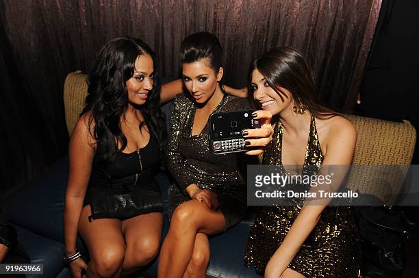 Lala Vasquez, Kim Kardashian and Brittny Gastineau attend TAO Nightclub at the Venetian on October 16, 2009 in Las Vegas, Nevada.