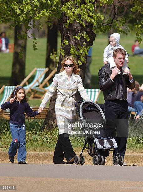 Singer Madonna walks with her husband, producer Guy Ritchie, daughter Lourdes, and son Rocco, during an outing in Hyde Park April 21, 2002 in London,...