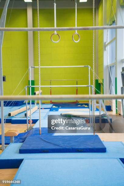 empty gym with gymnastics equipment - gymnastics equipment stock pictures, royalty-free photos & images