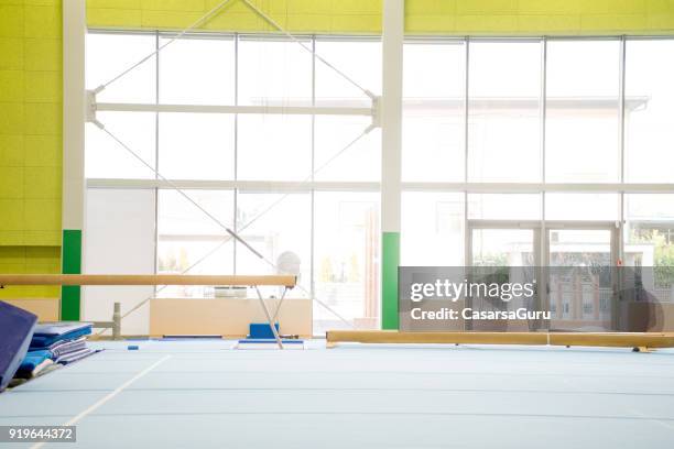 empty gym with gymnastics equipment - gymnastics equipment stock pictures, royalty-free photos & images