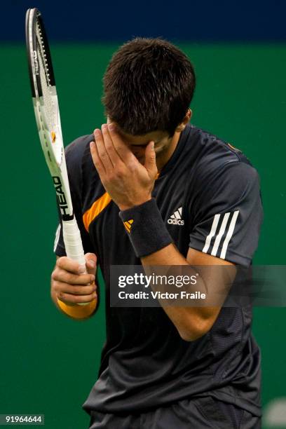 Novak Djokovic of Serbia reacts to a lose point against Nikolay Davydenko of Russia on their semi final match during day seven of 2009 Shanghai ATP...