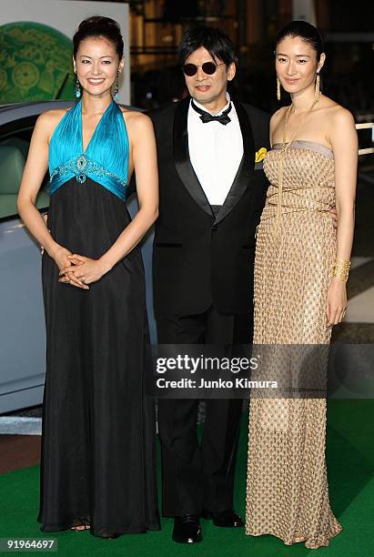 Japanese actress Tomoka Kurotani, director Yoshimitsu Morita and Japanese actress Koyuki walk on the green carpet during the 22nd Tokyo International...