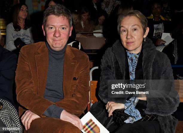 Alex Bilmes and Justine Picardie wearing Burberry at the Burberry February 2018 show during London Fashion Week at Dimco Buildings on February 17,...