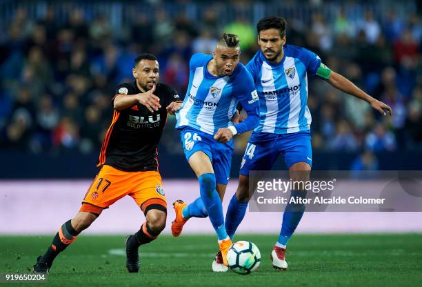 Youssef En-Nesyri of Malaga duels for the ball with Francis Coquelin of of Valencia CF during the La Liga match between Malaga and Valencia at...