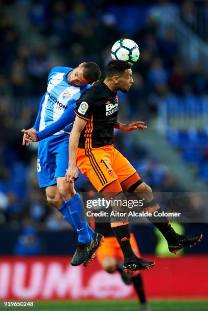Medhi Lacen of Malaga duels for the ball with Francis Coquelin of of Valencia CF during the La Liga match between Malaga and Valencia at Estadio La...