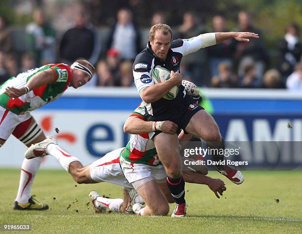 James Simpson- Daniel of Gloucester is tackled by Magnus Lundduring the Heineken Cup match between Biarritz Olympique and Gloucester at Parc de...