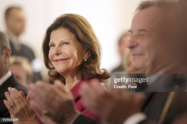 Queen Silvia of Sweden applauds during the opening of the first german section in a hospital for dementia patients following the model of her...