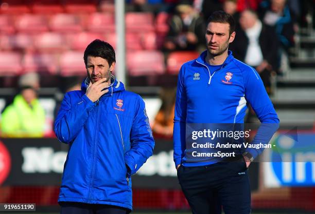 Lincoln City manager Danny Cowley, left, and Lincoln City's first team coach/under 23 manager Jamie McCombe during the pre-match warm-up prior to the...