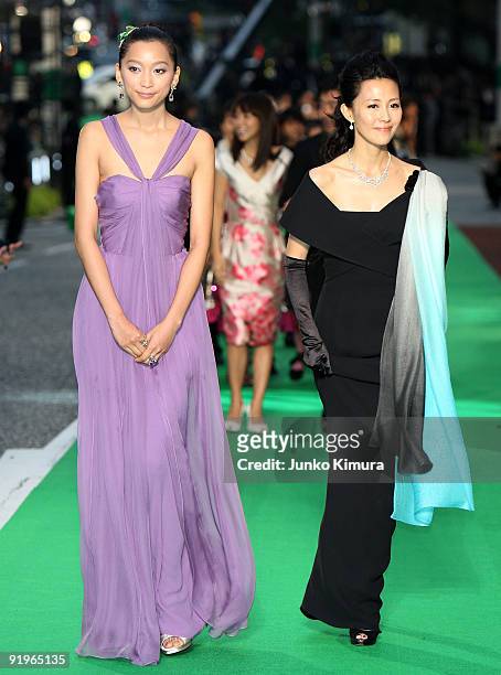 Japanese Model Anne and actress Yoshino Kimura walk on the green carpet during the 22nd Tokyo International Film Festival Opening Ceremony at...