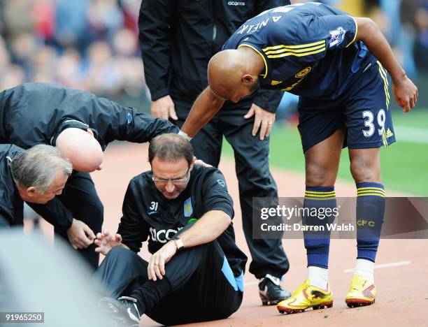 Martin O'Neill manager of Aston Villa is given assistance after colliding with Nicolas Anelka of Chelsea during the Barclays Premier League match...