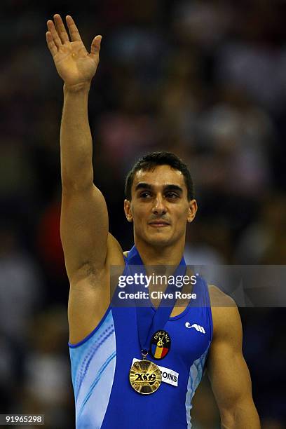 Marian Dragulescu of Romania poses with his gold medal after he won the floor exercise event during the Apparatus Finals on the fifth day of the...