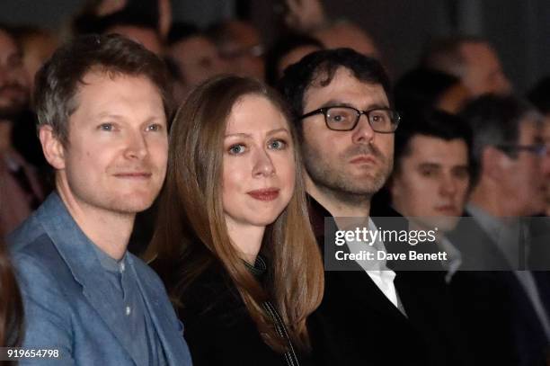 Simon Woods, Chelsea Clinton and Marc Mezvinsky wearing Burberry at the Burberry February 2018 show during London Fashion Week at Dimco Buildings on...