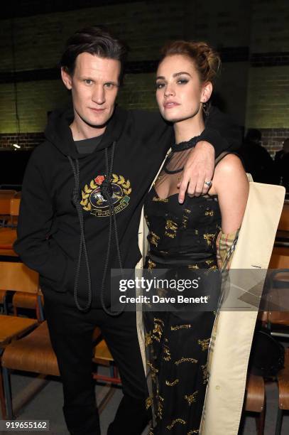 Matt Smith and Lily James wearing Burberry at the Burberry February 2018 show during London Fashion Week at Dimco Buildings on February 17, 2018 in...