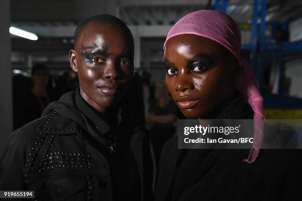 Grace Bol and a model are seen backstage ahead of the Gareth Pugh show during London Fashion Week February 2018 at Ambika P3 on February 17, 2018 in...