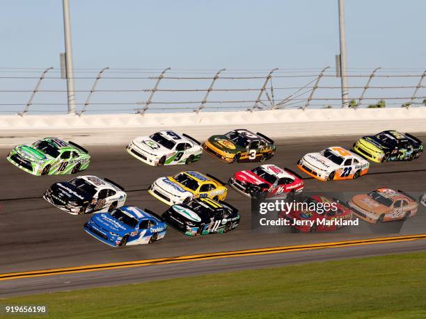 Elliott Sadler, driver of the OneMain Financial Chevrolet, and Aric Almirola, driver of the Smithfield/DenBeste Water Solutions Ford, lead a pack of...