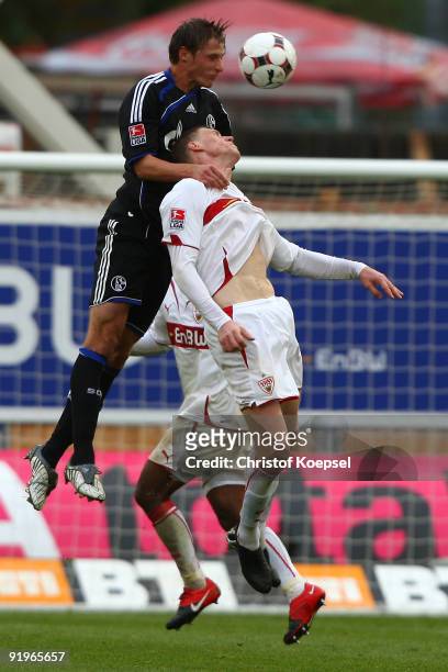 Benedikt Hoewedes of Schalke and Pavel Pogrebnyak of Stuttgart jump for a header during the Bundesliga match between VfB Stuttgart and FC Schalke 04...