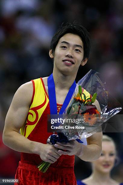 Kai Zou of China poses after he came third in the floor exercise event during the Apparatus Finals on the fifth day of the Artistic Gymnastics World...