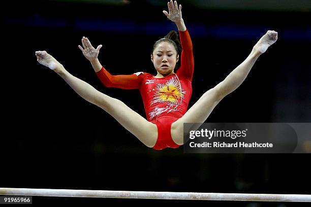 Koko Tsurumi of Japan competes in the uneven bars during the Apparatus Finals on the fifth day of the Artistic Gymnastics World Championships 2009 at...