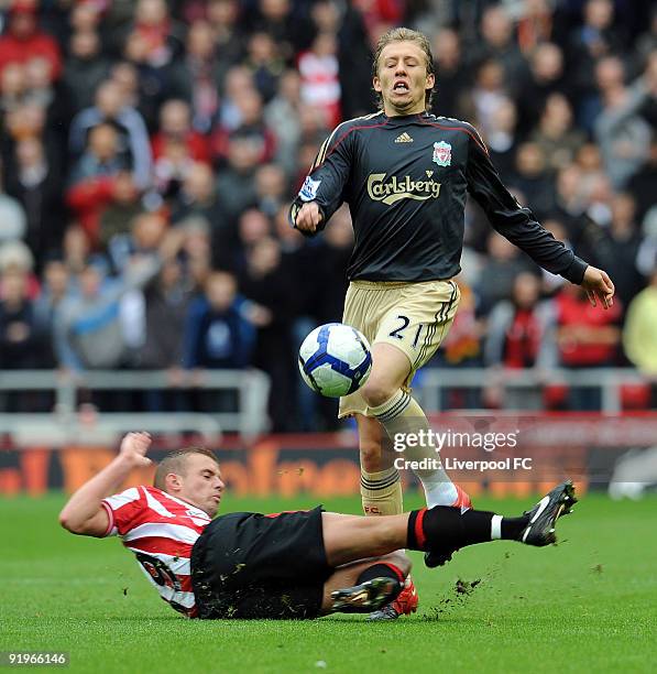 Lucas Levia of Liverpool is tackled by Lee Cattermole of Sunderland during the Barclays Premier League match between Sunderland and Liverpool at the...