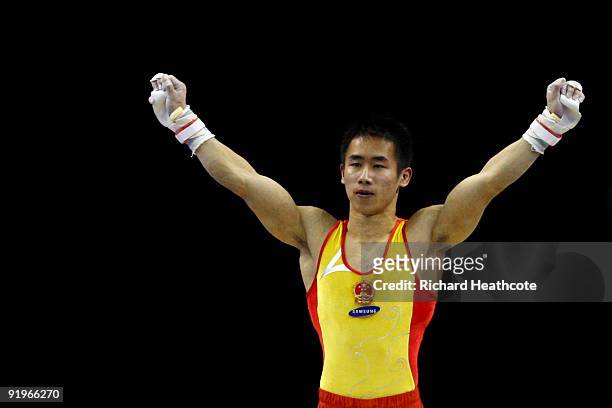 Mingyong Yan of China reacts after he competed on the rings during the Apparatus Finals on the fifth day of the Artistic Gymnastics World...